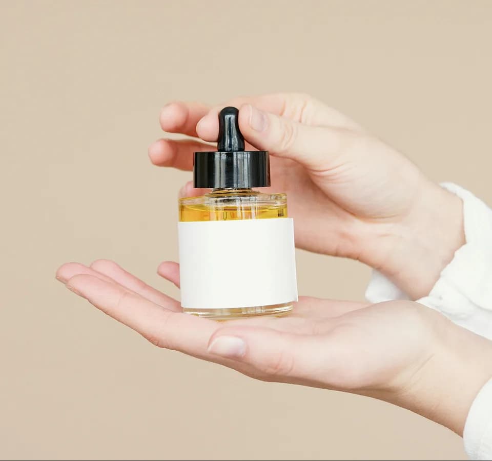 Serum dropper held against the light